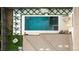 Aerial view of a modern pool and patio space, with furniture for entertaining and relaxing at 5455 E Cedar Ave, Denver, CO 80246