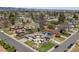 Expansive aerial view of the property showcasing the home's location in a residential neighborhood at 5455 E Cedar Ave, Denver, CO 80246