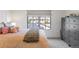 Well-lit bedroom with plush bedding, dresser and a view of the neighborhood at 5455 E Cedar Ave, Denver, CO 80246