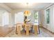 Stylish dining room with a modern light fixture and beautiful architectural details at 5455 E Cedar Ave, Denver, CO 80246