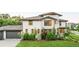 Lovely two-story home with an attached garage and beautifully landscaped surroundings at 5455 E Cedar Ave, Denver, CO 80246