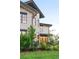 Well-manicured lawn and beautiful landscaping enhance the curb appeal of this home at 5455 E Cedar Ave, Denver, CO 80246