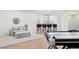 Recreation room with a modern pool table, bar seating and a comfortable sofa at 5455 E Cedar Ave, Denver, CO 80246
