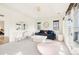 Inviting living room with ample natural light, a comfortable sofa and stylish decor at 5455 E Cedar Ave, Denver, CO 80246
