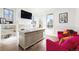 Bright office space featuring a large desk, wainscoting, and pink accent chairs at 5455 E Cedar Ave, Denver, CO 80246