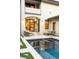 This outdoor pool is adjoined by a patio and a door to the house at 5455 E Cedar Ave, Denver, CO 80246