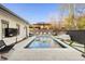 Beautiful outdoor pool and patio area, complete with stylish lounge furniture and well-manicured landscaping at 5455 E Cedar Ave, Denver, CO 80246