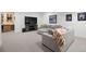 Finished basement offering ample seating, large screen tv and custom bar with wine storage at 7079 S Locust Pl, Centennial, CO 80112