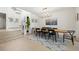 Spacious dining room with wood floor, modern table, and chandelier at 7079 S Locust Pl, Centennial, CO 80112