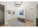 Bright and airy entryway with high ceilings, chandelier, and bench at 7079 S Locust Pl, Centennial, CO 80112