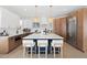 Modern kitchen featuring a spacious island with seating, stainless steel appliances, and ample lighting at 7079 S Locust Pl, Centennial, CO 80112