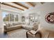 Bright, spacious living room featuring a large sectional sofa and expansive view from the large window at 7079 S Locust Pl, Centennial, CO 80112