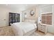 Cozy main bedroom boasting a comfortable bed, ample natural light, and stylish furnishings at 7079 S Locust Pl, Centennial, CO 80112