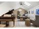 Stylish home office with a grand piano, skylight, custom desk, and wood paneling at 7079 S Locust Pl, Centennial, CO 80112