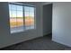 Bedroom with a view and neutral decor, carpeted floors at 21459 Randolph Pl, Denver, CO 80249