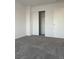 Bright bedroom featuring a large closet and neutral wall colors at 21459 Randolph Pl, Denver, CO 80249