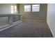 Spacious carpeted bedroom with two windows at 21459 Randolph Pl, Denver, CO 80249