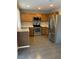 Kitchen with stainless steel appliances and oak cabinets at 21459 Randolph Pl, Denver, CO 80249