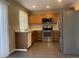 Kitchen with stainless steel appliances and oak cabinets at 21459 Randolph Pl, Denver, CO 80249