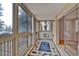 Enclosed balcony provides a cozy space with abundant natural light and views at 6930 E Girard Ave # 106, Denver, CO 80224