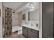 Well-lit bathroom featuring modern fixtures, a tiled shower/tub, and neutral decor at 6930 E Girard Ave # 106, Denver, CO 80224
