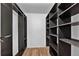 Spacious walk-in closet offers ample storage solutions with built-in shelving at 6930 E Girard Ave # 106, Denver, CO 80224