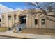 Exterior of the clubhouse featuring a stone facade, steps, and clear signage for easy access at 6930 E Girard Ave # 106, Denver, CO 80224