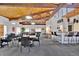 Spacious clubhouse featuring a bar area, tables, and a billiards area for social gatherings and entertainment at 6930 E Girard Ave # 106, Denver, CO 80224