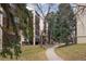 Apartment building exterior showing well-maintained landscaping and walkways for residents at 6930 E Girard Ave # 106, Denver, CO 80224