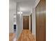 Hallway view with access to the bathroom and closet; lovely wood flooring at 6930 E Girard Ave # 106, Denver, CO 80224
