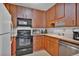 Efficient kitchen boasts ample cabinet space and essential appliances for easy meal preparation at 6930 E Girard Ave # 106, Denver, CO 80224