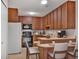 Efficient kitchen boasts ample cabinet space and essential appliances, with a dining area at 6930 E Girard Ave # 106, Denver, CO 80224