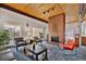 Inviting lobby area with comfortable seating, a brick fireplace, and stylish decor at 6930 E Girard Ave # 106, Denver, CO 80224