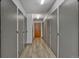 Hallway featuring multiple storage lockers, creating additional space at 6930 E Girard Ave # 106, Denver, CO 80224