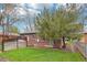 Beautifully landscaped backyard with a well-maintained lawn and privacy fence at 2459 S Corona St, Denver, CO 80210