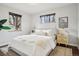 Bright bedroom featuring a comfortable bed, natural light, and modern decor at 2459 S Corona St, Denver, CO 80210