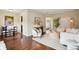 Bright living room featuring hardwood floors, a cozy seating area, and stylish decor at 2459 S Corona St, Denver, CO 80210