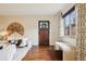 Bright living room with hardwood floors, stylish decor, and a welcoming, comfortable seating area at 2459 S Corona St, Denver, CO 80210