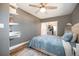 Well-lit bedroom features hardwood floors, shelving, and an open closet with ample storage space at 4827 Meade St, Denver, CO 80221