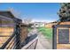 Inviting front yard with a walkway leading to the home, framed by a stylish gate at 4827 Meade St, Denver, CO 80221