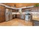 Spacious kitchen with wooden cabinets, stainless steel appliances, and granite countertops at 24030 San Isabel Rd, Indian Hills, CO 80454