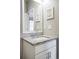 Stylish bathroom features a granite countertop vanity, modern fixtures, and a well-lit mirror at 181 S Monaco Pkwy, Denver, CO 80224