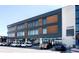 Modern office building with mixed-use commercial spaces and ample parking at 181 S Monaco Pkwy, Denver, CO 80224