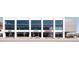 A contemporary retail building with large windows, offering various dining options at 181 S Monaco Pkwy, Denver, CO 80224