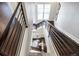 Overhead view of a modern staircase with dark wood steps and sleek metal railings at 181 S Monaco Pkwy, Denver, CO 80224