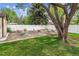 Well-maintained backyard featuring a rock garden, lawn, mature trees, and a privacy fence, offering a serene outdoor space at 2990 S Jay St, Denver, CO 80227