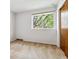 Empty bedroom with neutral carpet, white walls, a window, and a closet at 2990 S Jay St, Denver, CO 80227