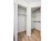 Two walk-in closets in a bright room with light, wood-look flooring at 7680 Depew St # 1404, Arvada, CO 80003