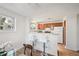 Bright and airy kitchen featuring bar seating, wood cabinets and lots of natural light at 7680 Depew St # 1404, Arvada, CO 80003