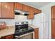 Kitchen featuring stainless steel appliances, wooden cabinets and light countertops at 7680 Depew St # 1404, Arvada, CO 80003